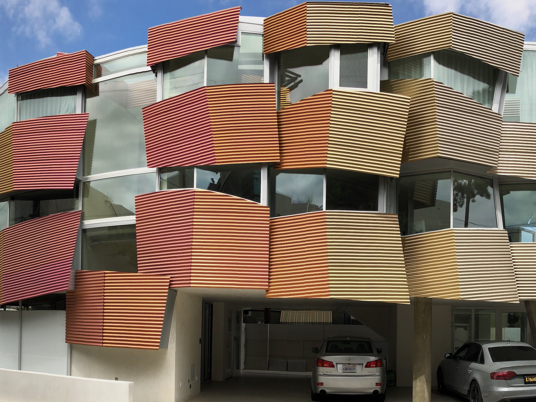 Corrugated Titanium Panels at Different Angles Create a Range of Color Effects with Angle of the Sun