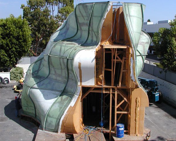 A large white sculpture in an industrial setting.