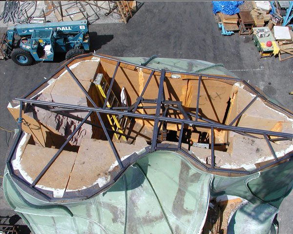 A large white sculpture in an industrial setting.