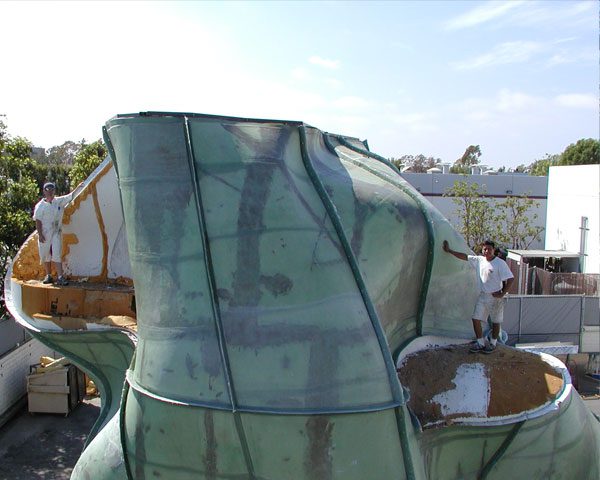 A large white sculpture in an industrial setting.