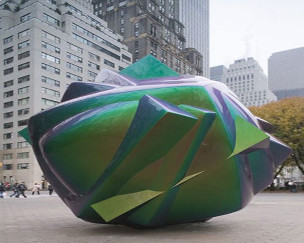 A green and yellow object sitting on top of a table.