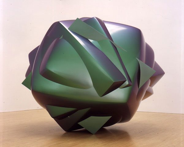 A green and yellow object sitting on top of a table.